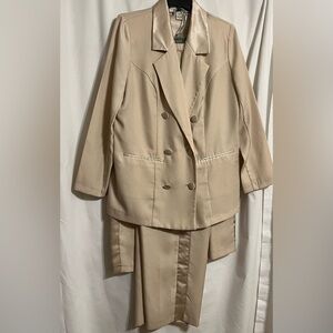 Roman‘s three-piece jacket, pants and skirt suit in ivory. size 14W